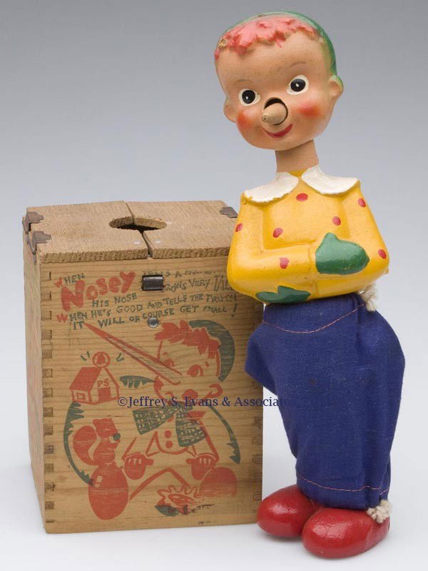 JONTHAY "NOSEY" JACK-IN-THE-BOX TOY: JONTHAY "NOSEY" JACK-IN-THE-BOX TOY painted composition, wood and fabric figure with spring legs, in original wooden box with graphics. Second quarter 20th century. Box 5 3/4" H. Provenance: Estate co