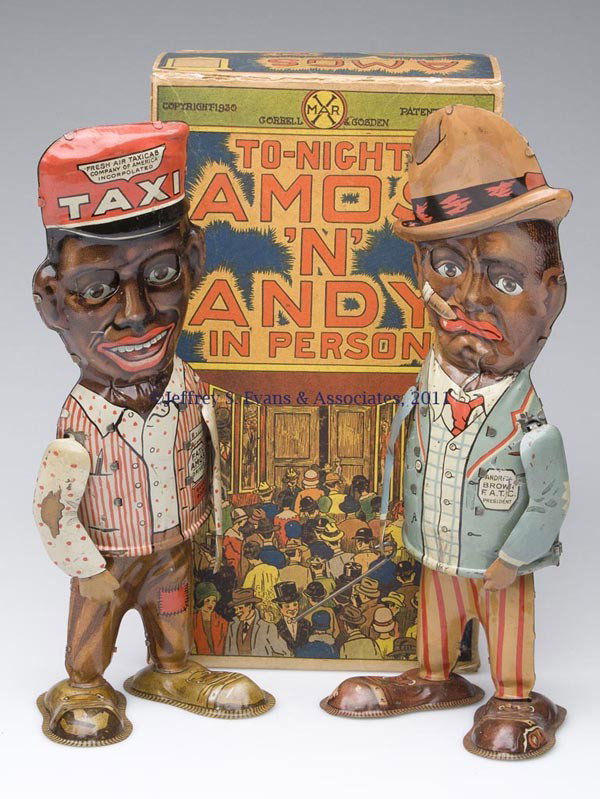 BLACK AMERICANA MARX "AMOS 'N' ANDY IN PERSON" WIN: BLACK AMERICANA MARX "AMOS 'N' ANDY IN PERSON" WIND-UP TIN TOYS WITH BOX each walker-style figure with articulated arms and google eyes, one with cane. With original box. Second quarter 20th century. 
