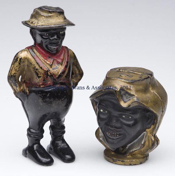 BLACK AMERICANA CAST-IRON STILL BANKS, LOT OF TWO: BLACK AMERICANA CAST-IRON STILL BANKS, LOT OF TWO small-size two-faced boy with original paint and Sharecropper with partial original paint. Attributed to A. C. Williams. First quarter 20th century. 3