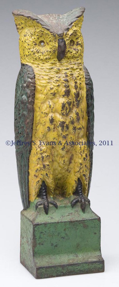 OWL ON PEDESTAL CAST-IRON DOORSTOP: OWL ON PEDESTAL CAST-IRON DOORSTOP single sided, original paint with wear, lacking bumpers. Attributable to Bradley and Hubbard. First half 20th century. 15 5/8" H, 4 7/8" WOA.