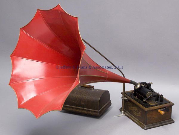 EDISON STANDARD CYLINDER PHONOGRAPH: EDISON STANDARD CYLINDER PHONOGRAPH oak dome-top case, with repainted morning glory horn supported on an attached arm, plaque with patent dates from 1888 to 1898. Late 19th/early 20th century. 13" x 9