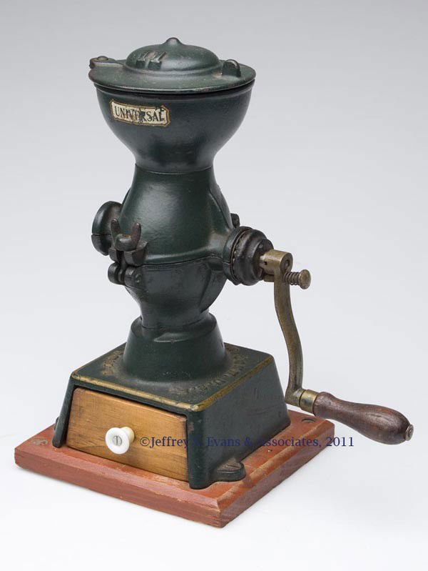 UNIVERSAL CAST-IRON COFFEE MILL: UNIVERSAL CAST-IRON COFFEE MILL single crank with swivel lid, marked for L. F. & Co., wooden drawer and base, original paint and decals. Late 19th/early 20th century. 12 1/4" HOA.