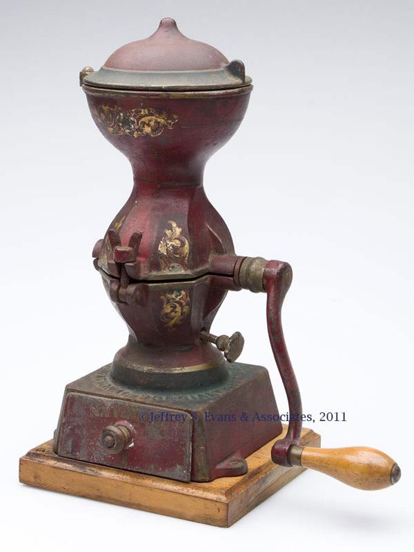 NATIONAL #1 CAST-IRON COFFEE MILL: NATIONAL #1 CAST-IRON COFFEE MILL single crank with swivel lid and original drawer, mounted on a wooden base, original paint and decals. Late 19th/early 20th century. 13" HOA.