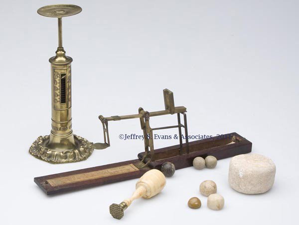 TWO ASSORTED SCALES: TWO ASSORTED SCALES comprising a brass pedestal example and a folding brass sovereign example in original case labeled for "Robert Lowe, Maker, Preston". Along with an ivory and brass wax seal and sev