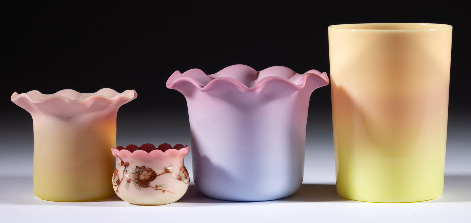 ASSORTED BURMESE AND PEACHBLOW GLASS ARTICLES, LOT OF FOUR,: ASSORTED BURMESE AND PEACHBLOW GLASS ARTICLES, LOT OF FOUR,plush and glossy, including a Mt. Washington tumbler, and a Thomas Webb enamel-decorated open salt.Various makers.19th and 20th century.1 1/4