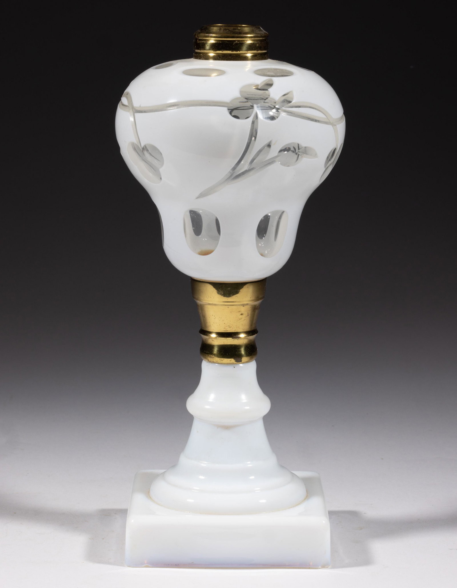 CUT OVERLAY BERRY AND VINE KEROSENE STAND LAMP: CUT OVERLAY BERRY AND VINE KEROSENE STAND LAMP, opaque white to colorless pyriform font with a medial berry and vine pattern bordered by an upper and lower band of cut ovals, brass connector, fiery op