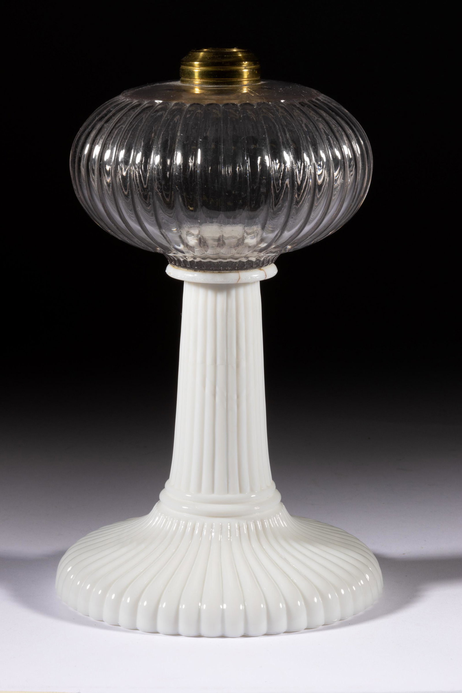 ONION / EATON / ILLUMINATOR KEROSENE STAND LAMP,: ONION / EATON / ILLUMINATOR KEROSENE STAND LAMP,colorless font above opaque white base,No. 1 Taplin Brown collar.Probably Atterbury & Co.1865-1880.9 3/4" H, 5 7/8" D base. Literature: Thuro- Oil Lamps