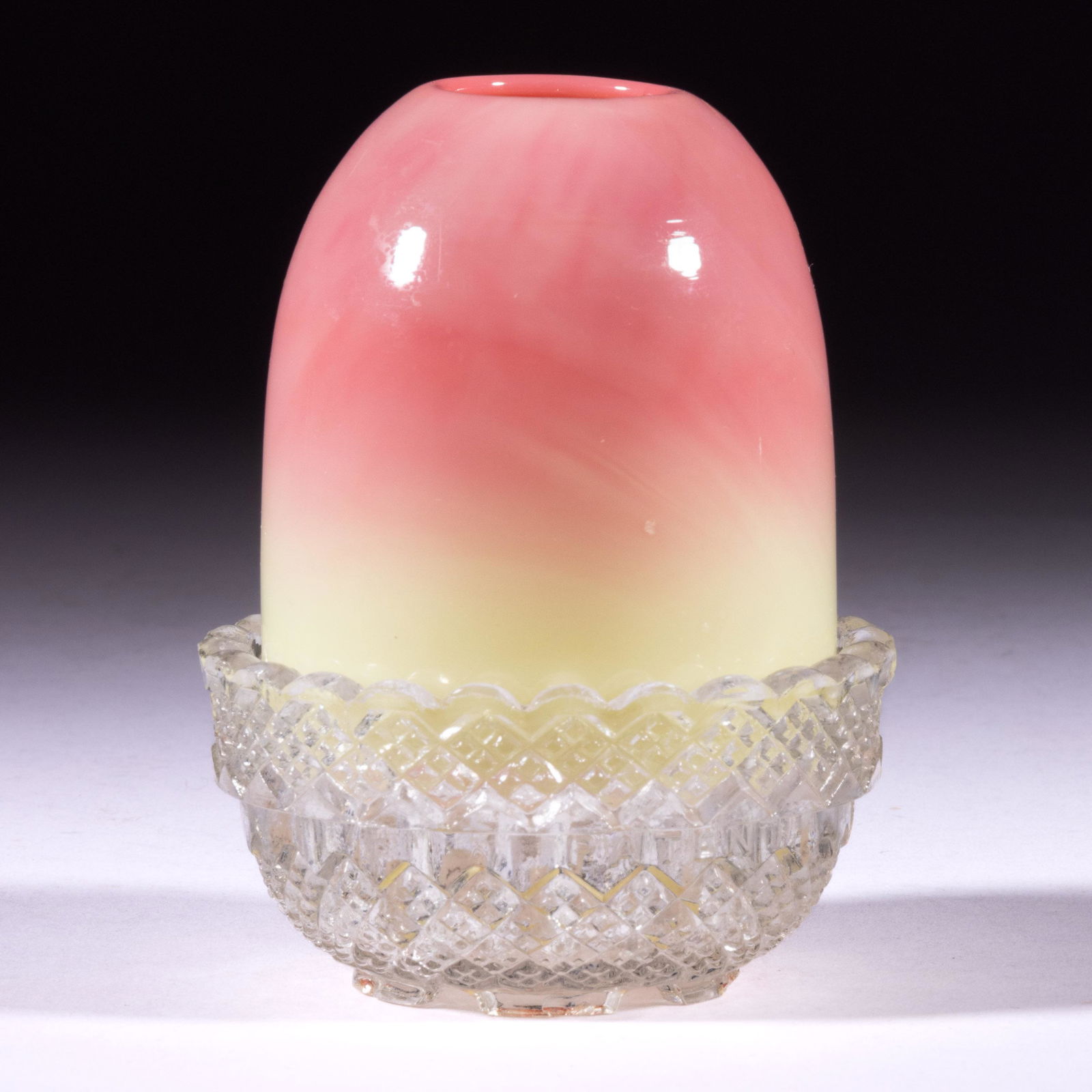 WEBB BURMESE FAIRY LAMP: WEBB BURMESE FAIRY LAMP, LOT OF TWO,glossy finish, pyramid-size shade resting in colorless S. Clarke's Fairy Pyramid lamp cup. Thomas Webb & Sons. Late 19th/early 20th century. 3 3/4" HOA.