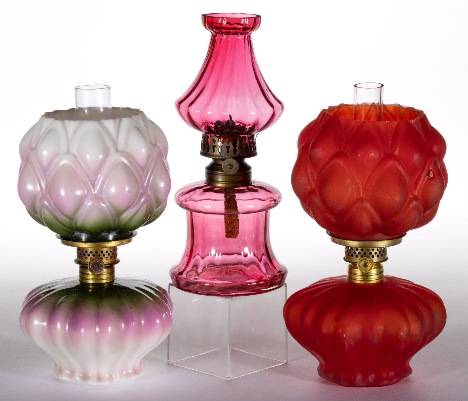 ASSORTED PATTERN MINIATURE LAMPS, LOT OF THREE: ASSORTED PATTERN MINIATURE LAMPS, LOT OF THREE,assorted colors,comprising two Artichoke/Smith I, fig. III, including a cased cranberry with satin finish and remaining opaque white with green and laven