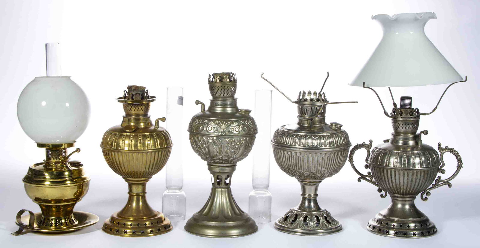 ASSORTED BRASS AND NICKEL-PLATE MINIATURE LAMPS, LOT OF FIVE: ASSORTED BRASS AND NICKEL-PLATE MINIATURE LAMPS, LOT OF FIVE, comprising four stand examples, including two examples with a bead and rib pattern, one example fitted with an opaque white umbrella-form 