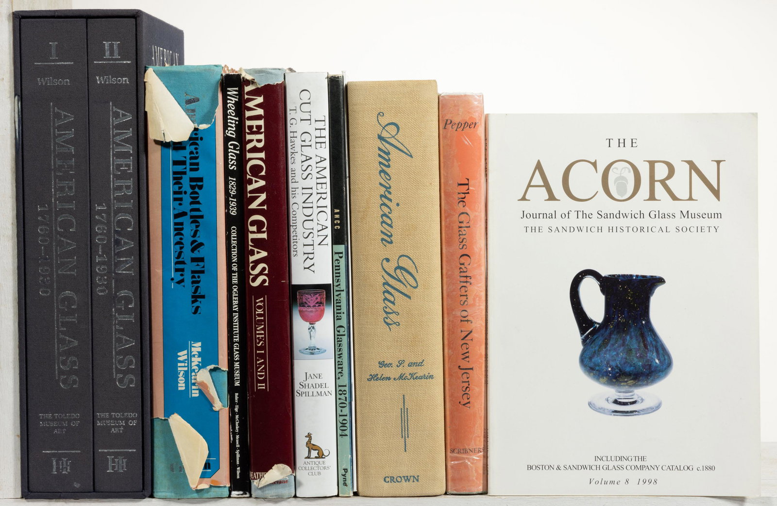 ASSORTED AMERICAN GLASS REFERENCE VOLUMES, LOT OF 11: ASSORTED AMERICAN GLASS REFERENCE VOLUMES, LOT OF 11,includes a two-piece set American Glass 1760-1930 by Wilson; American Bottles & Flasks and Thier Ancestry by McKearin/Wilson; American Cut Glass In