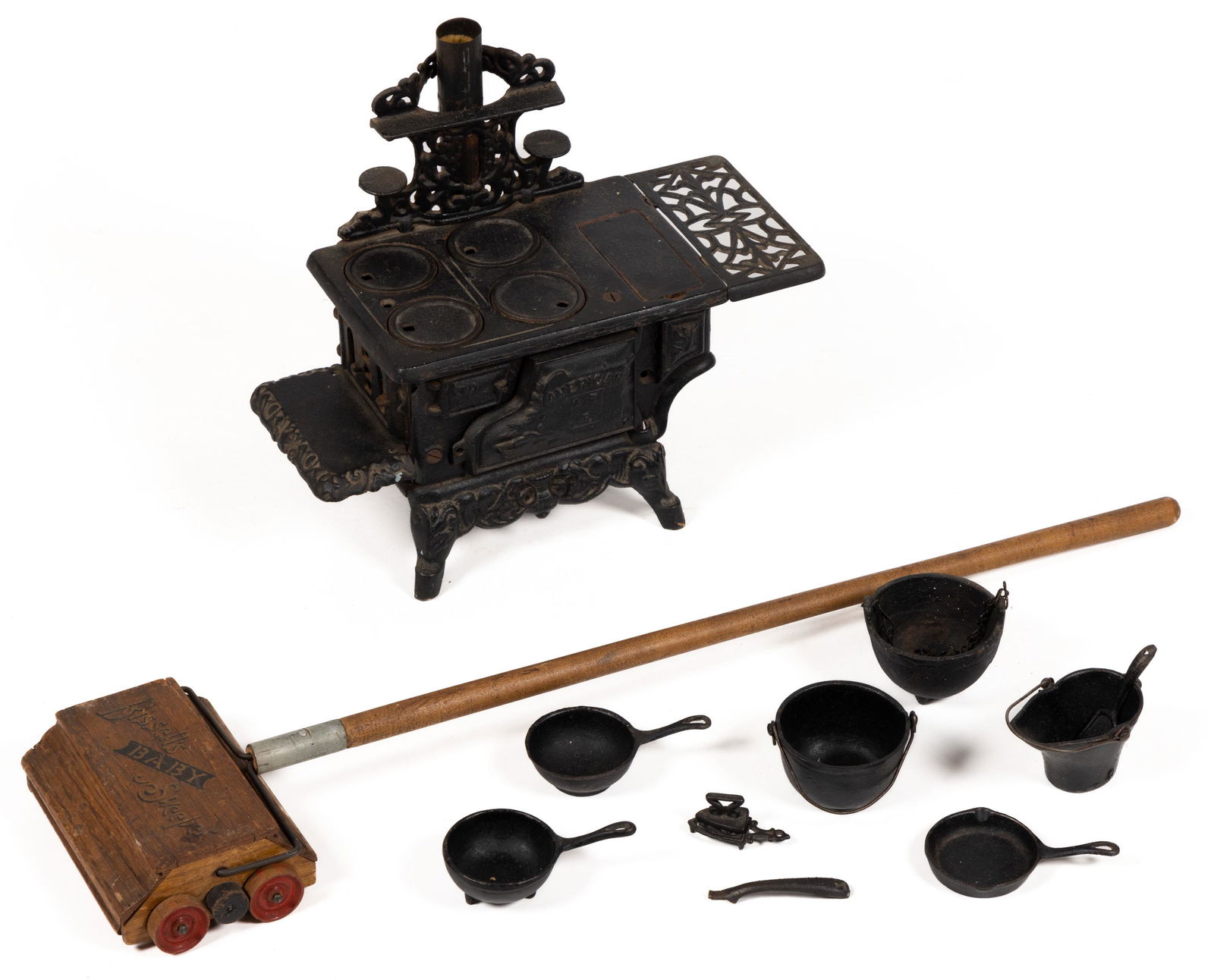 BISSELL'S BABY SWEEPER / AMERICAN CAST-IRON TOY STOVE, LOT OF TWO (1 of 4)