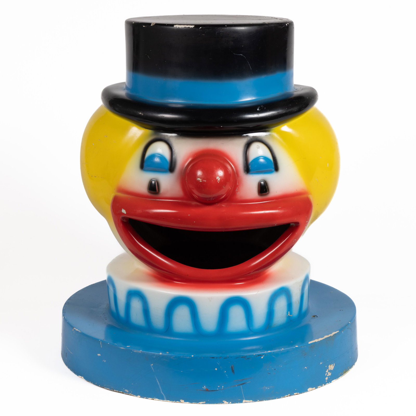 VINTAGE CARNIVAL CLOWN-HEAD GARBAGE CAN TOPPER: VINTAGE CARNIVAL CLOWN-HEAD GARBAGE CAN TOPPER, airbrushed fiberglass with open mouth on two sides, original label for Kiddies, Inc., Puerto Rico. Circa 1970. 26 1/2" HOA, 23 1/2" D. Shipping Note: IN