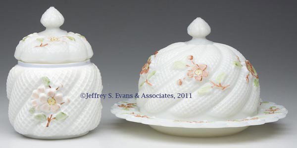 APPLE BLOSSOM TABLE ARTICLES, LOT OF TWO: APPLE BLOSSOM TABLE ARTICLES, LOT OF TWO, opaque white/milk glass with polychrome decoration, comprising a butter dish and a covered sugar bowl. Northwood Glass Co. Late 19th/early 20th century. 5 1/4
