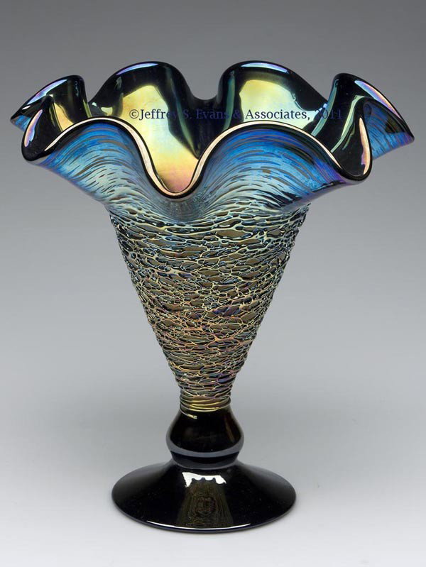 STUART ABELMAN STUDIO GLASS VASE: STUART ABELMAN STUDIO GLASS VASE, iridescent deep amethyst, random thread decoration, signed "Abelman VSW300-44 1986" under the foot. 8 3/4" H, 8 1/2" D rim. Provenance: Collection of Bertram (Bert) C