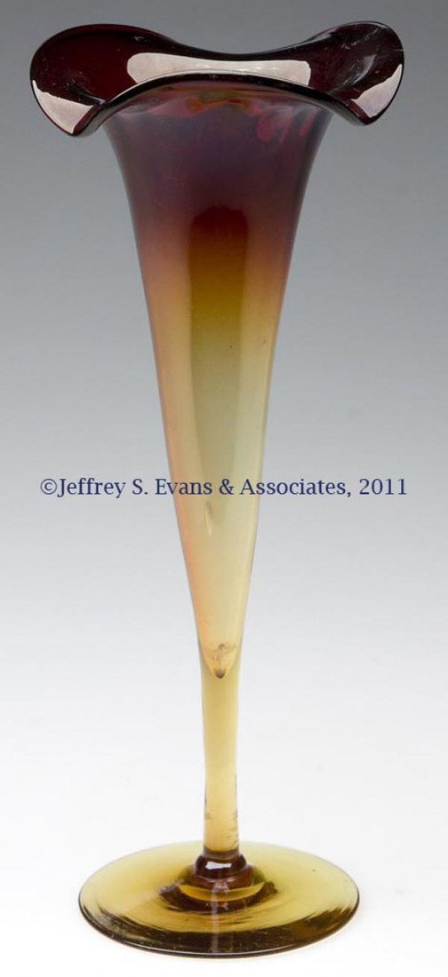 AMBERINA RIB-OPTIC LILY VASE: AMBERINA RIB-OPTIC LILY VASE, 16 ribs, two-part construction, polished pontil mark. Possibly Mt. Washington Glass Co. Late 19th/early 20th century. 10 3/8" HOA, 4" DOA.