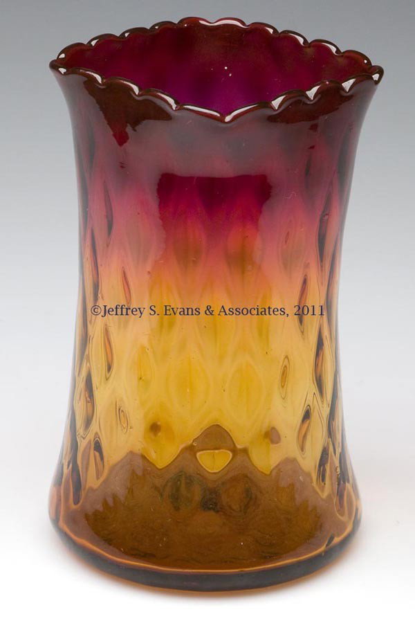 AMBERINA DIAMOND-OPTIC CELERY VASE: AMBERINA DIAMOND-OPTIC CELERY VASE, with a square, scalloped rim and rough pontil mark. Probably W. L. Libbey & Sons. Late 19th/early 20th century. 6" H, 3 1/8" SQ rim.