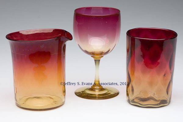 AMBERINA OPTIC PATTERN ARTICLES, LOT OF THREE: AMBERINA OPTIC PATTERN ARTICLES, LOT OF THREE, comprising a Diamond Optic tumbler, a lightly ribbed claret, and a Tiny Diamond-Optic beaker, each with a polished pontil mark. W. L. Libbey & Sons and o