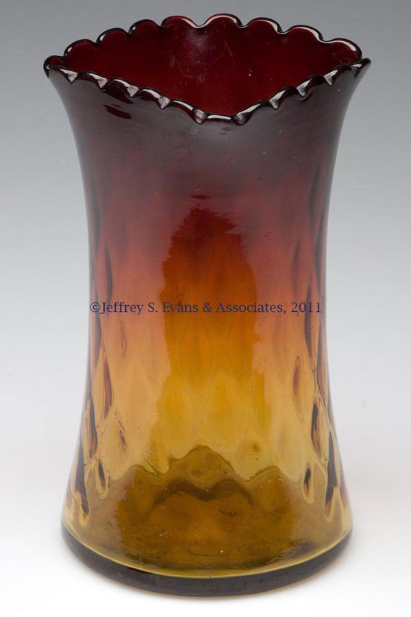 AMBERINA DIAMOND-OPTIC CELERY VASE: AMBERINA DIAMOND-OPTIC CELERY VASE, with a square, scalloped rim and polished pontil mark. Probably Mt. Washington Glass Co. Late 19th/early 20th century. 6 3/4" H, 3 1/4" SQ rim.
