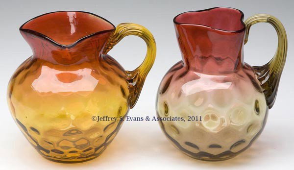 AMBERINA INVERTED THUMBPRINT PITCHERS, LOT OF TWO: AMBERINA INVERTED THUMBPRINT PITCHERS, LOT OF TWO, one square and one triangular rim, each with amber applied reeded handle and polished pontil mark. Probably Hobbs, Brockunier & Co. and Phoenix Glass