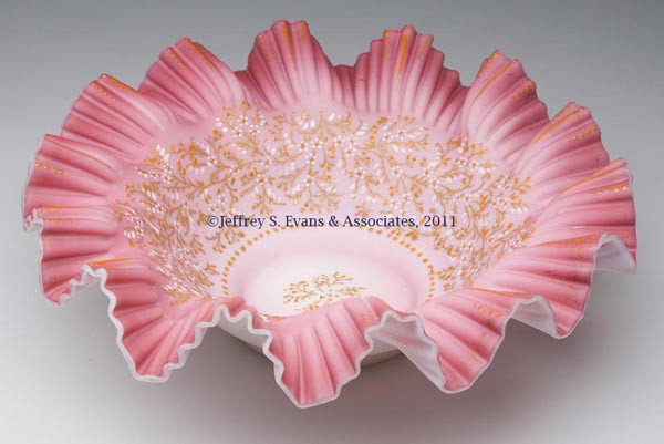 CASED SATIN GLASS BRIDE'S BOWL: CASED SATIN GLASS BRIDE'S BOWL, shaded rose interior with enamel and gilt decorations, crimped and ruffled rim, ground pontil mark. Fourth quarter 19th century. 3 1/2" H, 11 1/4" D rim, 3 7/8" D base.