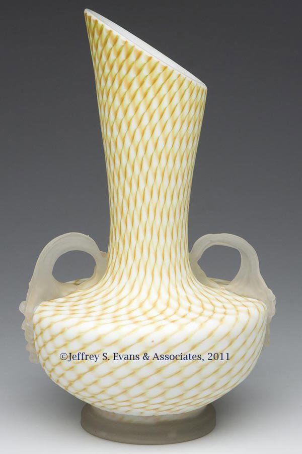 LATTICEWORK SATIN GLASS VASE: LATTICEWORK SATIN GLASS VASE, pastel green and orange on an opal ground, applied frosted colorless ribbed handles and disk-like foot with polished pontil mark. Possibly Franz Welz, Bohemia. Late 19th/