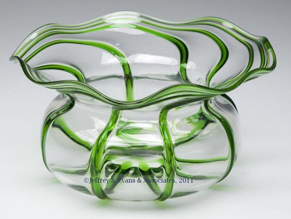 ENGLISH RIB-DECORATED GLASS FERNERY: ENGLISH RIB-DECORATED GLASS FERNERY, colorless with eight applied green ribs swirled at the rim, polished pontil mark. Stuart & Sons and possibly others. First quarter 20th century. 4 1/4" H, 8 1/4" D
