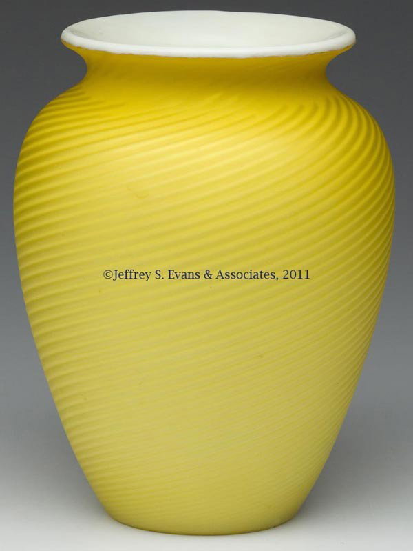 SWIRL AIR-TRAP MOTHER-OF-PEARL SATIN GLASS VASE: SWIRL AIR-TRAP MOTHER-OF-PEARL SATIN GLASS VASE, bright yellow, polished pontil mark and table ring. Possibly Stevens and Williams. Fourth quarter 19th century. 6" H, 3 1/2" D rim. Provenance: From an