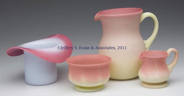 20TH CENTURY ART GLASS ARTICLES, LOT OF FOUR: 20TH CENTURY ART GLASS ARTICLES, LOT OF FOUR, comprising a Gundersen Burmese individual creamer and open sugar, each with a polished pontil mark; a Pairpoint Peachblow hat; and an Italian Burmese crea