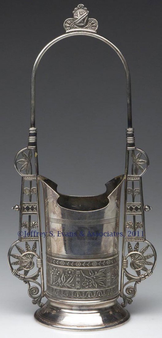 PAIRPOINT QUADRUPLE-PLATE SPOONER: PAIRPOINT QUADRUPLE-PLATE SPOONER, featuring chinoiserie design, company name, trademark and "801" on base. Pairpoint Mfg. Co. Fourth quarter 19th century. 11 3/4" HOA, 3 1/2" DOA.