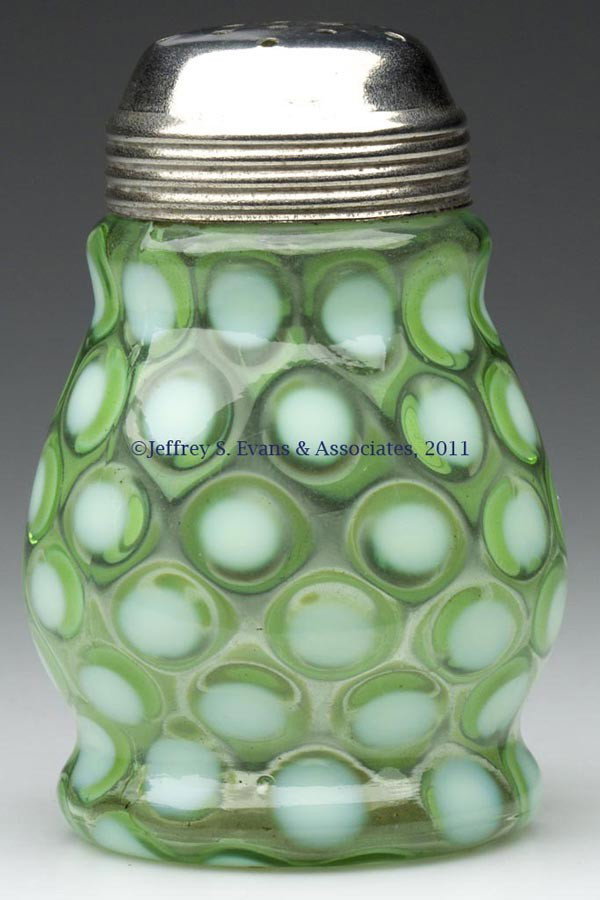 COINSPOT - WIDE-WAIST SUGAR SHAKER: COINSPOT - WIDE-WAIST SUGAR SHAKER, green opalescent, period lid. Late 19th/early 20th century. 4 3/4" HOA. Provenance: Estate collection of Dorothy and Marshall Jenkins.