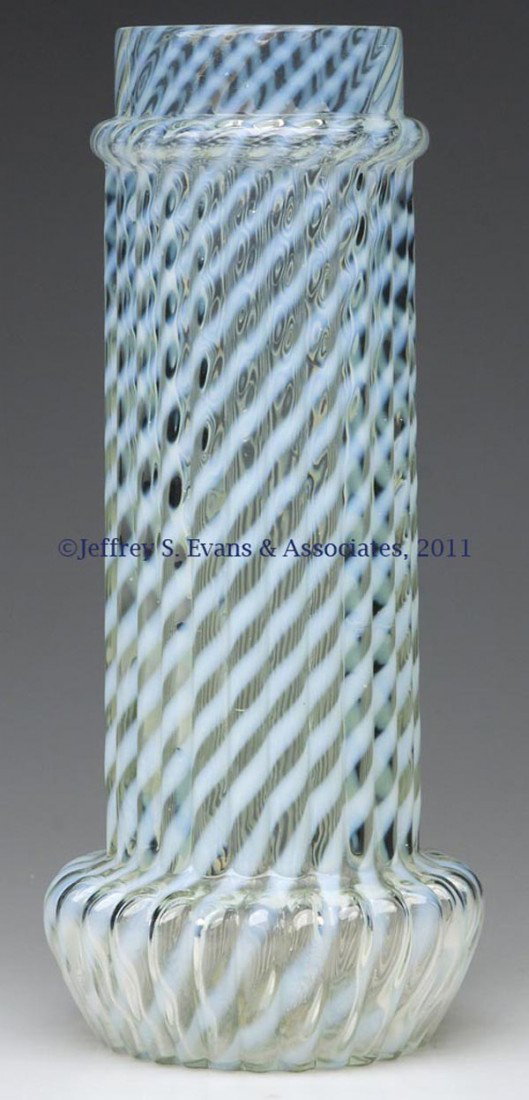 CHRYSANTHEMUM SWIRL STRAW JAR BASE: CHRYSANTHEMUM SWIRL STRAW JAR BASE, colorless opalescent. Northwood Glass Co./Buckeye Glass Co. Late 19th/early 20th century. 10 3/4" H.Provenance: From a Michigan collection.