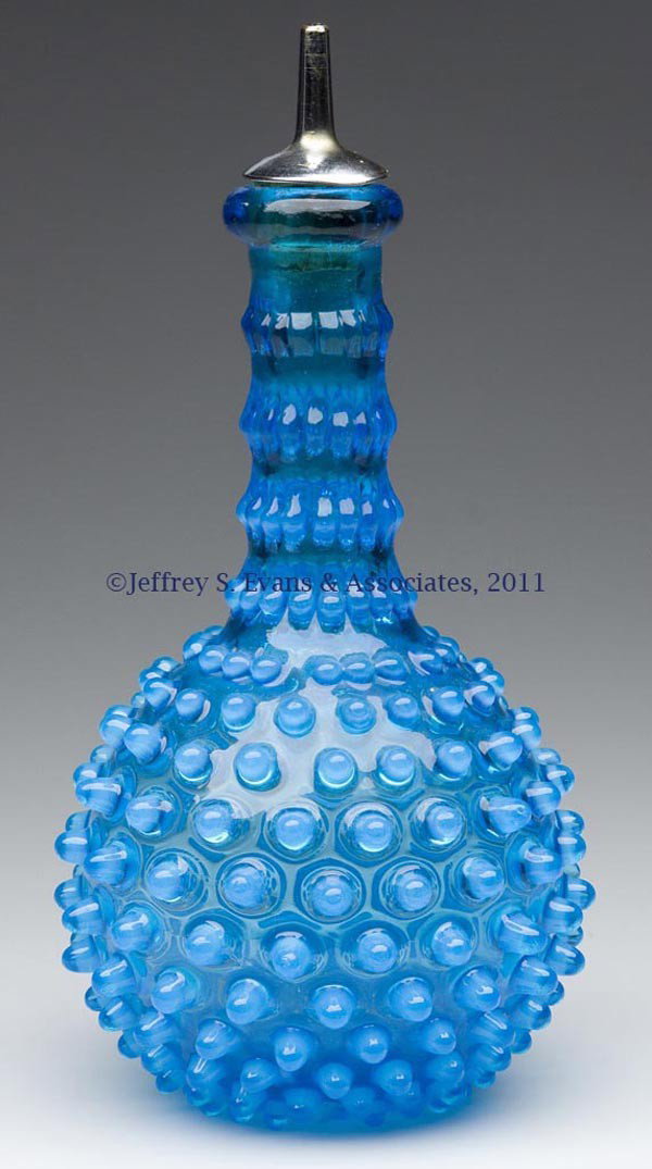 HOBBS' NO. 323 DEW DROP / HOBBS' HOBNAIL BARBER BO: HOBBS' NO. 323 DEW DROP / HOBBS' HOBNAIL BARBER BOTTLE, Sapphire opalescent/blue opalescent, pour spout, polished pontil mark. Hobbs, Brockunier & Co. Fourth quarter 19th century. 8" HOA, 3 3/4" DOA. 