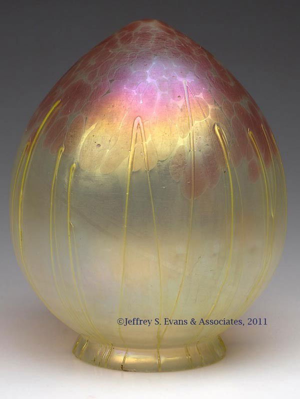 LOETZ-TYPE PENDANT SHADE: LOETZ-TYPE PENDANT SHADE, vaseline with rose mottling, oil spots with applied vertical trailings. First quarter 20th century. 7" H, 3 3/8" D fitter. Provenance: Jerry Lynn Wood, Dequincy, LA.