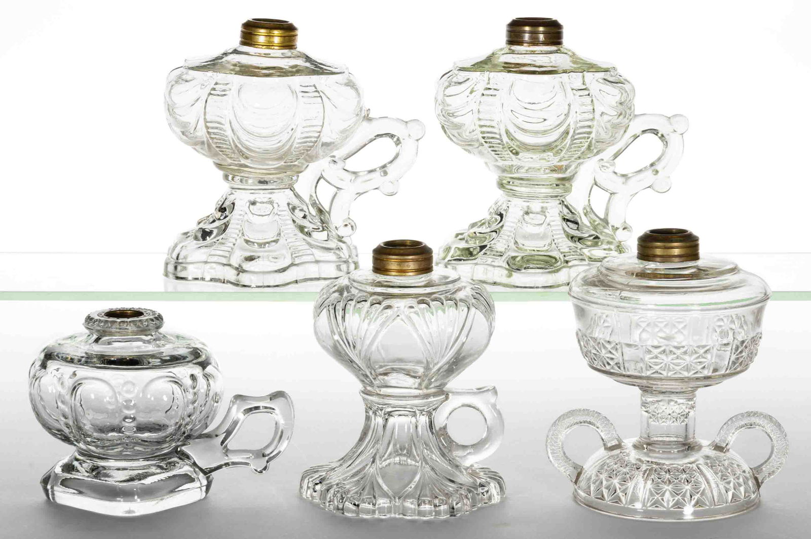 ASSORTED PATTERNED GLASS KEROSENE FOOTED FINGER LAMPS, LOT OF FIVE (1 of 1)