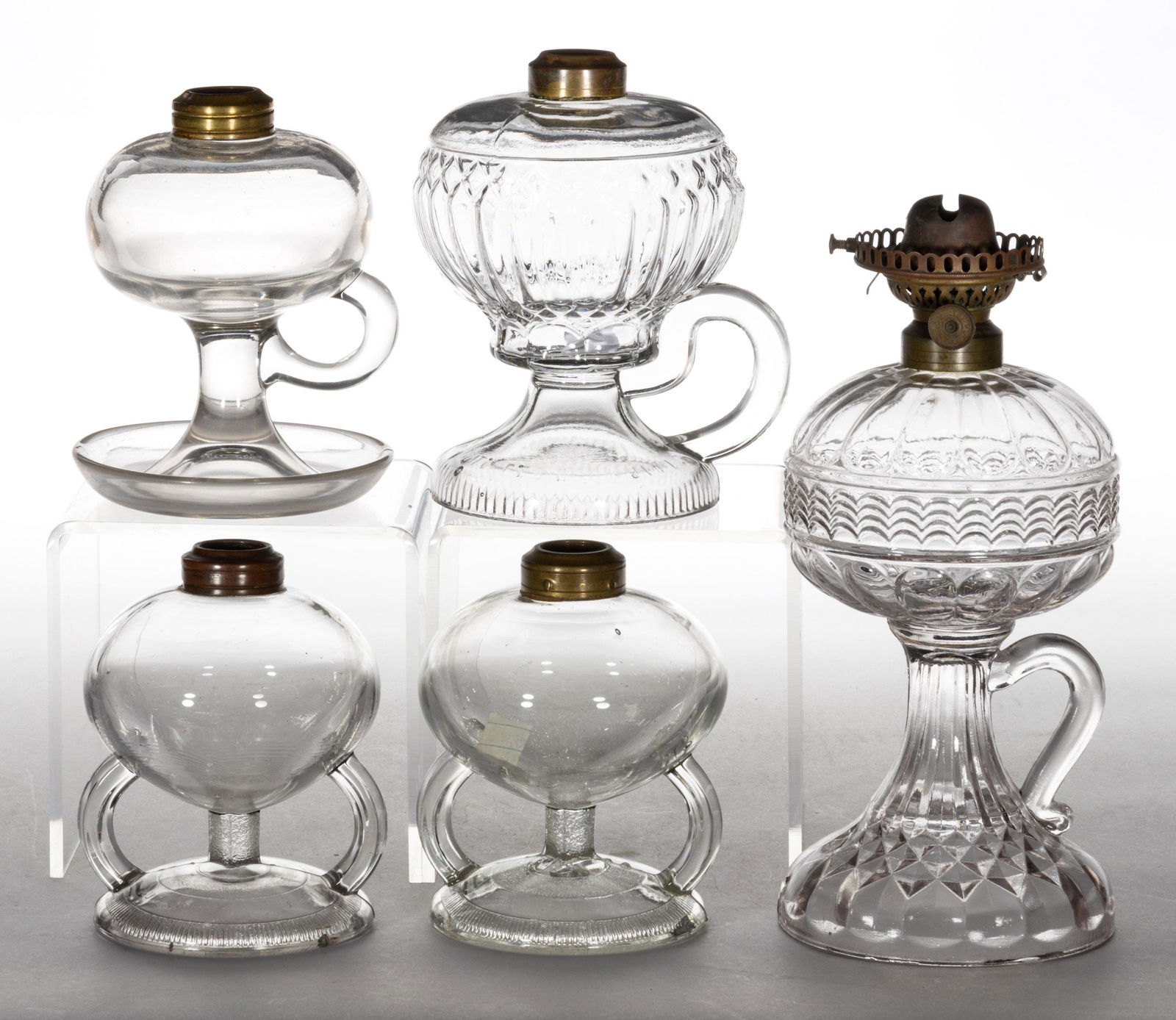 ASSORTED PATTERNED KEROSENE FOOTED FINGER LAMPS, LOT OF FIVE (1 of 1)