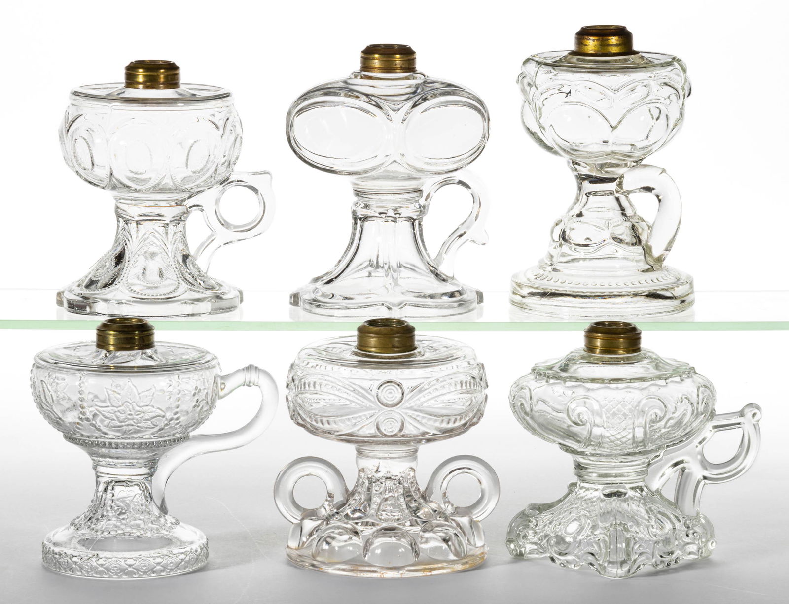 ASSORTED PATTERNED GLASS KEROSENE FOOTED FINGER LAMPS, LOT OF SIX (1 of 1)