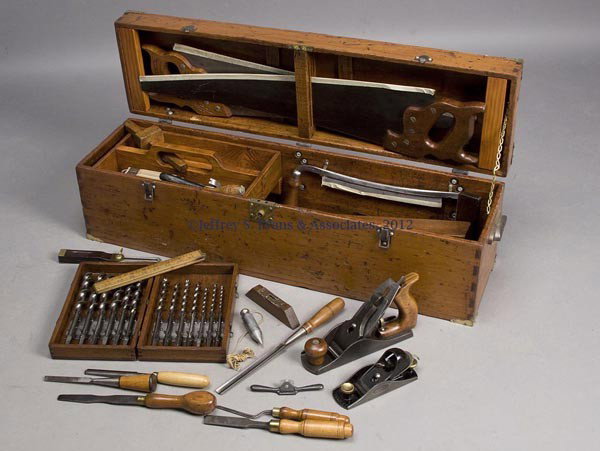 COUNTRY PINE CARPENTER'S TOOL BOX AND TOOLS: COUNTRY PINE CARPENTER'S TOOL BOX AND TOOLS, dovetailed case with hinged lid, cast-iron handle on each end, interior with lift-out tool tote. Fitted with a variety of vintage tools including two plane