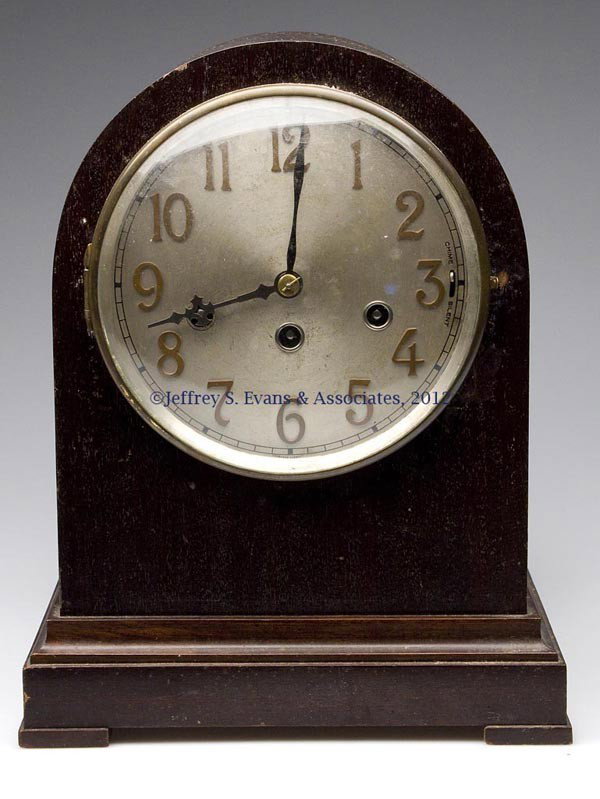 J. UNGHANS, GERMANY MAHOGANY MANTLE CLOCK: J. UNGHANS, GERMANY MAHOGANY MANTLE CLOCK, time and chimes, pendulum and key. First half 20th century. 13" H. Provenance: Estate collection of Dorothy and Marshall Jenkins.