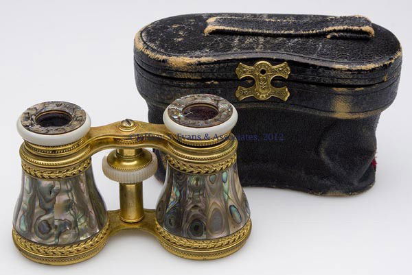 FINE PAIR OF GILT-BRASS AND MOTHER-OF-PEARL OPERA: FINE PAIR OF GILT-BRASS AND MOTHER-OF-PEARL OPERA GLASSES, unmarked, original leather case marked for The Duhme Co., Cincinnati, Ohio. Probably France. Fourth quarter 19th century. 2 3/8" H, 4" W. Pro