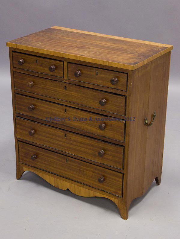 HEPPLEWHITE SATINWOOD CHILD'S CHEST OF DRAWERS: HEPPLEWHITE SATINWOOD CHILD'S CHEST OF DRAWERS, banded-edge top above a configuration of two over four graduated drawers, scalloped skirt and flared French feet. Drawers with applied and ebonized cock
