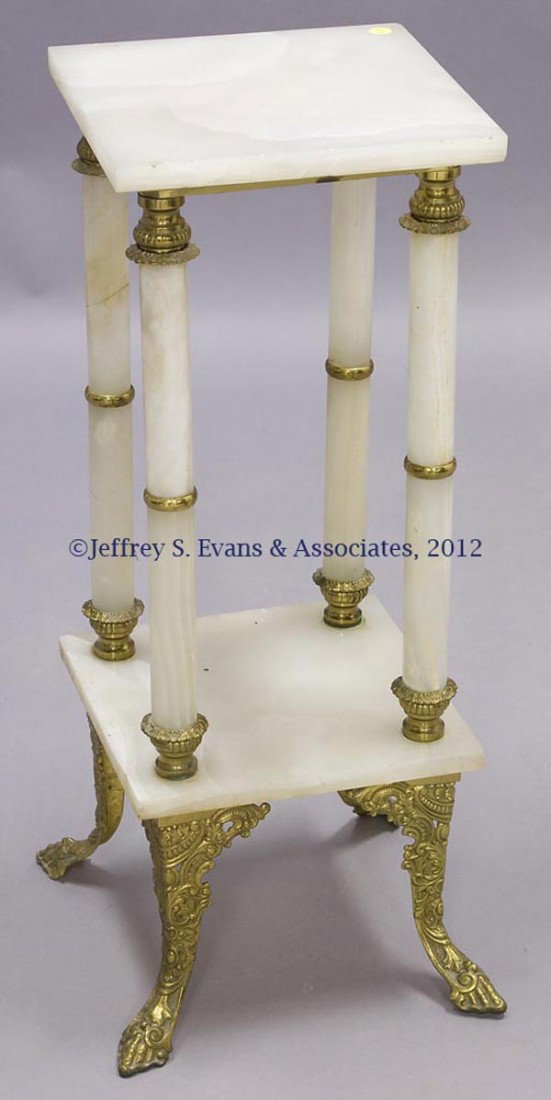 VICTORIAN GILT-BRASS AND ONYX TWO-TIER STAND: VICTORIAN GILT-BRASS AND ONYX TWO-TIER STAND, square top raised on columnar supports and four hoof-like feet. Circa 1880. 31" H, 12" x 12". Provenance: Estate collection of Dorothy Gooch, Hopkinsville