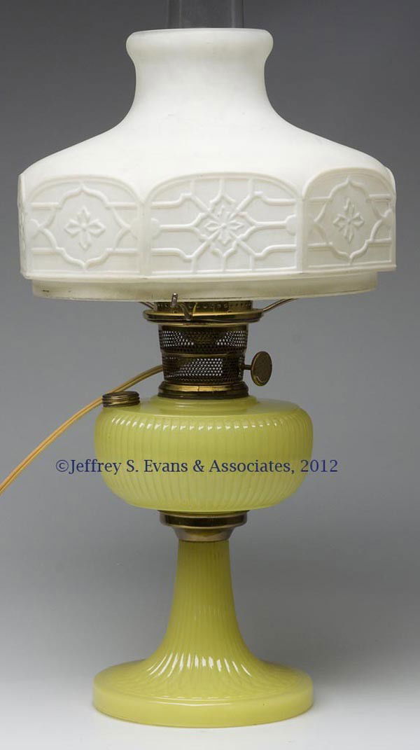 ALADDIN MODEL B-88 / VERTIQUE KEROSENE TABLE LAMP: ALADDIN MODEL B-88 / VERTIQUE KEROSENE TABLE LAMP, yellow moonstone art glass, metal connector, radial groove collar, electrified Nu-Type Model B Aladdin burner, non-period Aladdin chimney, satin whit