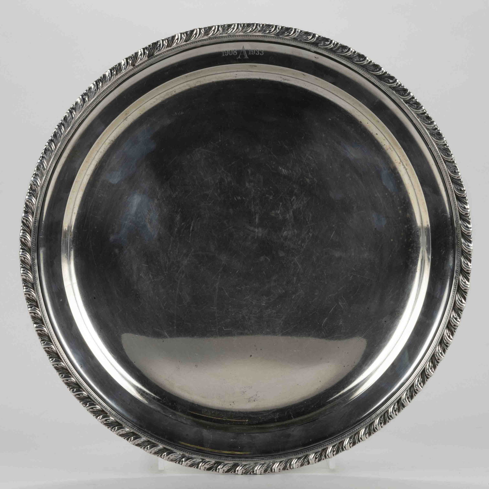 TIFFANY & CO. STERLING SILVER TRAY, round form with a foliate gadroon-type rim and a (1 of 3)