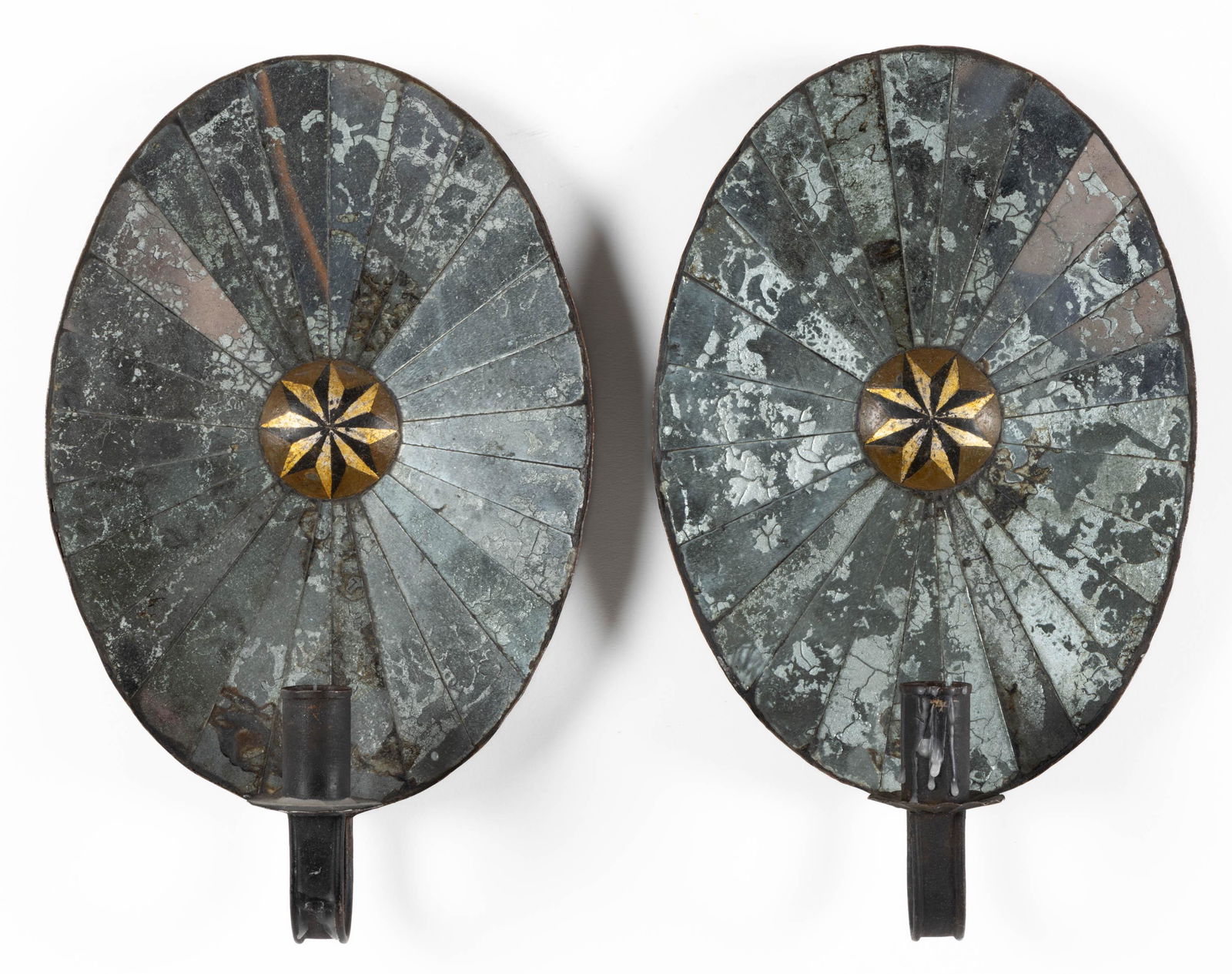 PAIR OF MIRRORED TIN SCONCES, each of oval form with single candle arm, painted decoration at (1 of 3)