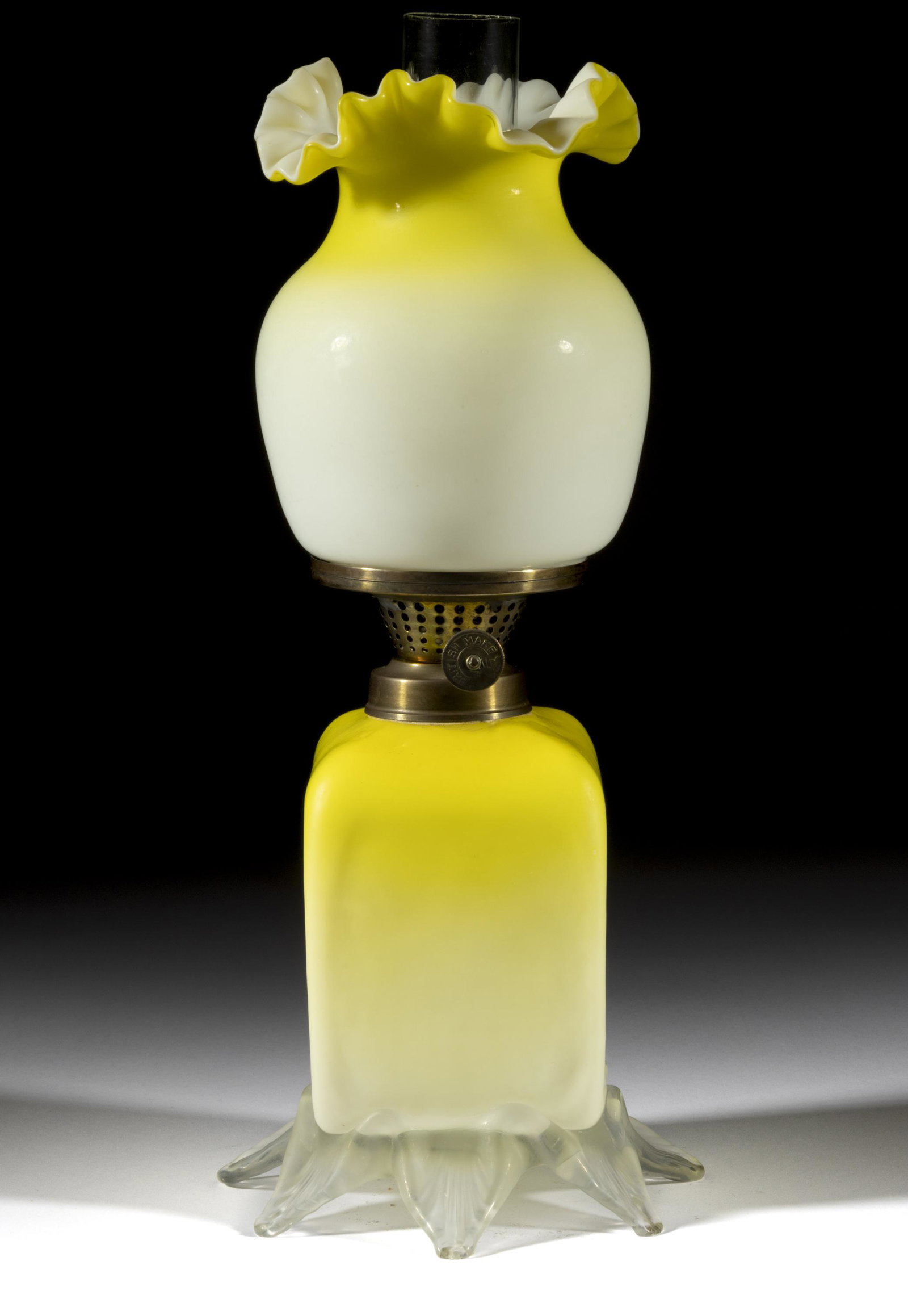 CASED AND SATIN ART GLASS MINIATURE LAMP: CASED AND SATIN ART GLASS MINIATURE LAMP, dark to light lemon yellow with satin finish, square-form unpatterned font, applied colorless base lightly raised on eight toes, each with a pr