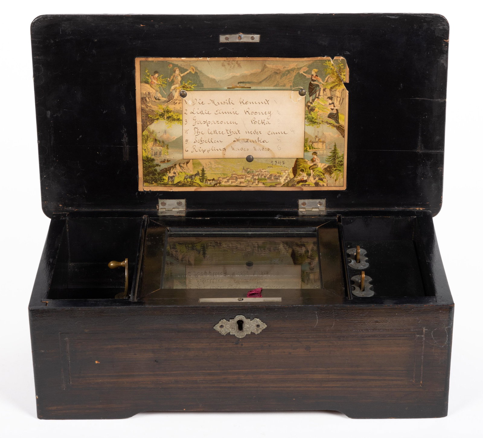 SWISS CYLINDER MUSIC BOX: SWISS CYLINDER MUSIC BOX, 4 1/2" cylinder playing six tunes on a steel comb with 41 teeth, original card attached to underside of lid. Fourth quarter 19th century. 5" H, 14" W, 7 1