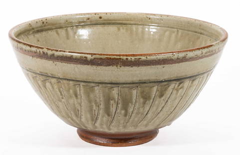 RICHARD BATTERHAM (ENGLISH, 1936-2021) STUDIO POTTERY STONEWARE LARGE BOWL: RICHARD BATTERHAM (ENGLISH, 1936-2021) STUDIO POTTERY STONEWARE LARGE BOWL, featuring incised exterior design with celadon glaze. Unmarked. Circa 1986. 7 1/2" H, 15" D rim. Catalog