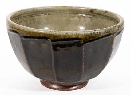 RICHARD BATTERHAM (ENGLISH, 1936-2021) STUDIO POTTERY STONEWARE LARGE BOWL: RICHARD BATTERHAM (ENGLISH, 1936-2021) STUDIO POTTERY STONEWARE LARGE BOWL, featuring faceted exterior design with dark olive green-glazed exterior and light celadon-glazed interior. Unmarked. Late 20