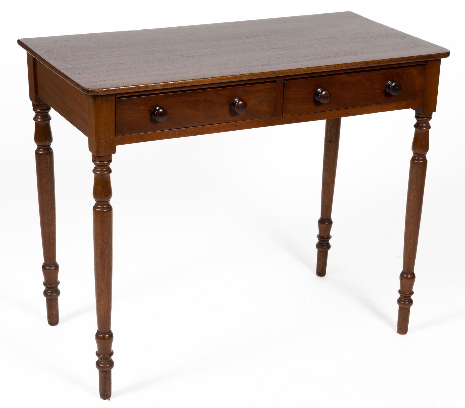 AMERICAN LATE FEDERAL MAHOGANY WRITING TABLE: AMERICAN LATE FEDERAL MAHOGANY WRITING TABLE, rectangular top above two drawers, raised on turned legs. Retains an old surface with warm color. 19th century. 29 1/2" H, 18" x 35 1/4".Sh